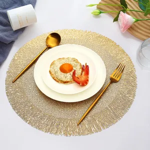 Nordic round gold placemat for dining table, heat-resistant hollow table mat for home kitchen decor.