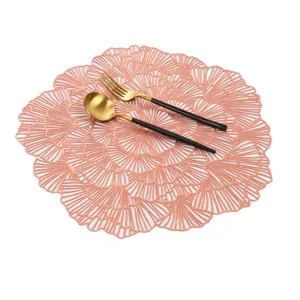 Pink hollow placemat detail view, PVC heat insulation table mat for home dining decor.