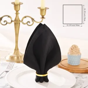 Solid color black linen cloth napkin with golden napkin ring for wedding hotel dining table decor.
