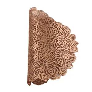 Rose hollow PVC gold placemat detail shot, showing intricate floral pattern and metallic finish.