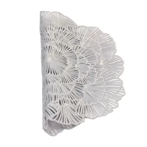 Close-up detail of hollow PVC placemat, decorative silver table mat, heat resistant design.
