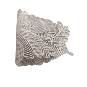 Detailed close-up of hollow leaf placemat, modern Nordic style PVC table mat, durable.