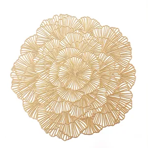 Gold hollow PVC placemat, modern floral design heat-resistant table mat for home dining decor.