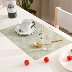 Green PU leather placemat, rectangular waterproof heat-resistant table mat for dining room table decor.