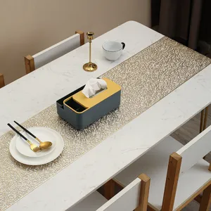 Long PVC gold stamped hollow table runner and heat-resistant decorative mat for dining table.