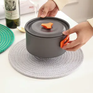 Ronde katoenen geweven warmte-isolerende placemat, brandwerende onderzetter voor keuken en tafel.