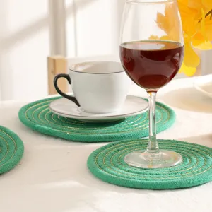 Ronde gevlochten katoenen placemat met gouden draad, hittebestendige tafel onderzetter.