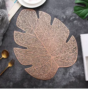 Gold hollow leaf placemat PVC table mat chic minimalist dining decor for kitchen.