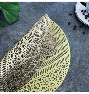 Gold hollow PVC placemat, washable waterproof heat insulation mat for home dining table decor.