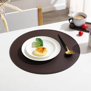 Round leather placemat, waterproof and oil-proof table pad, Nordic style dining decor detail.