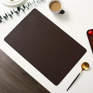 Dark brown leather placemat detail view, elegant minimalist table mat for dining decor.