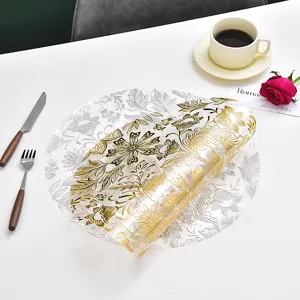 Nordic clear PVC placemat with gold floral stamping, waterproof, elegant table decor.