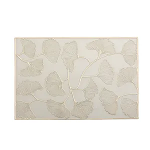 Elegant rectangular PVC placemat with golden ginkgo leaf pattern for home dining table decor.