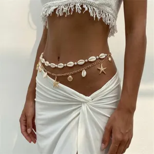 Detailed close-up of bohemian multi-layer waist chain with sea shells and starfish charms