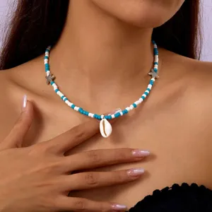 Bohemian beaded necklace with blue and white beads and cowrie shell pendant for women