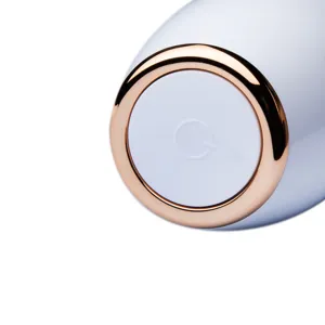 Electric wine aerator dispenser base detail shot, stylish champagne gold and white design.