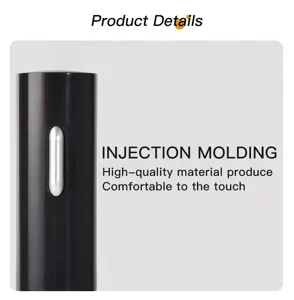 Electric wine opener detail view showing smooth black injection molded body and metal button.