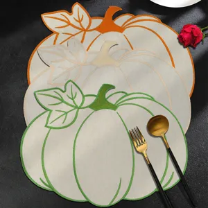 Embroidered pumpkin placemat for dining table, washable fabric table mat with luxury design.