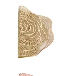 Gold hollow rose PVC placemat with waterproof and heat insulation features for dining table decor.
