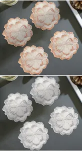 Detail view of exquisite Nordic style rose gold stamping PVC flower shaped coasters and mats.
