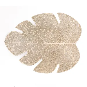 Gold PVC hollow tropical leaf placemat, luxury kitchen dining table heat insulation pad.