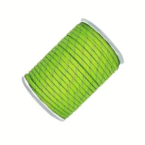 Detailed view of fluorescent green 4mm 7-core reflective outdoor paracord roll closeup.