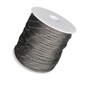Close-up of 4mm reflective 7-strand black paracord spool for outdoor camping and DIY bracelets.