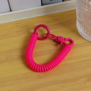 Llavero de resorte rosa vibrante cordón teléfono retráctil colgante bolsa escolar accesorio