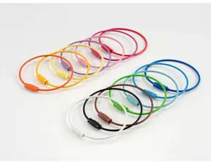 Detail shot of colorful stainless steel wire cable keychains with screw lock mechanism for DIY crafts.