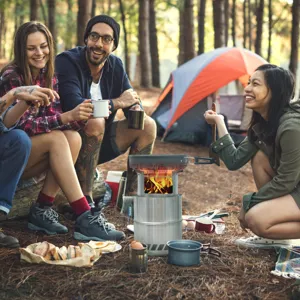 Portable outdoor stainless steel camping wood stove for picnic, hiking, and backpacking.