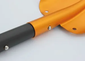 Detail view of the portable aluminum alloy folding snow shovel handle and connection joint.