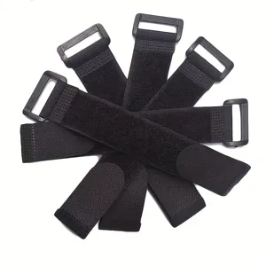 Correa de velcro negra con hebilla de plástico para agrupar y sujetar objetos.