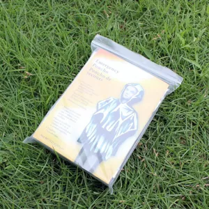 Emergency disposable thermal poncho for outdoor survival, windproof waterproof emergency gear.