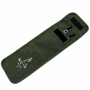 Close-up detail of green canvas camping tent stake storage bag with reinforced edge stitching.