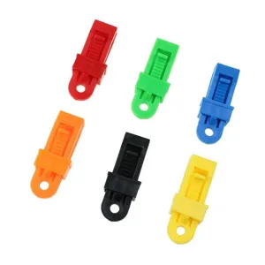 Colorful plastic tent clips set for outdoor camping canopy wind ropes and tarps.