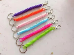 Colorful plastic coil spring keychain with metal clasp, flexible anti-lost lanyard accessory.
