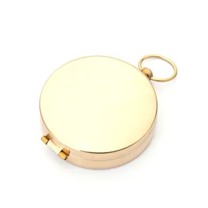 Outdoor brass pocket compass with flip cover, vintage style navigation tool for camping.