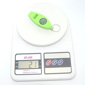 Outdoor 4-in-1 survival whistle with compass, lightweight portable emergency gear detail.