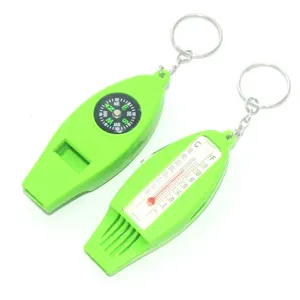 Green 4-in-1 outdoor survival whistle with built-in compass, thermometer, and keychain for camping.