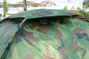 Detailed view of the camouflage camping tent roof, highlighting waterproof fabric and breathable design.