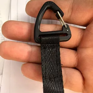 Tactical black plastic D-ring webbing buckle clip for outdoor camping backpack attachment.