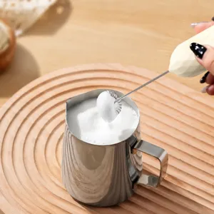 Handheld electric milk frother for coffee and cream, USB rechargeable with dual whisks.