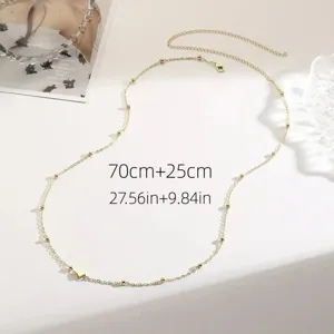 Detailed close-up view of gold beaded body chain with measurements 70cm+25cm shown.
