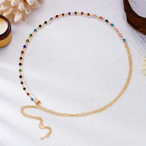 Detailed shot of multi-layer gold waist chain with colorful rhinestones and seed beads