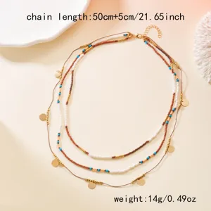 Detailed view of boho multi-layer beaded necklace with gold discs and size specs