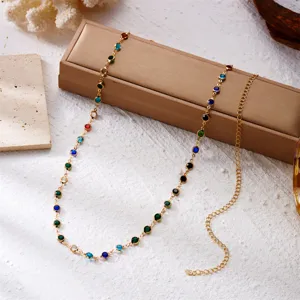 Close-up of beach style gold body chain featuring vibrant colorful rhinestones decoration