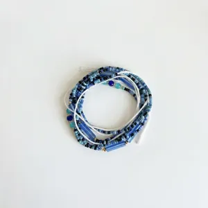 Detailed macro view of Bohemian multi-layer blue and black seed bead waist chain