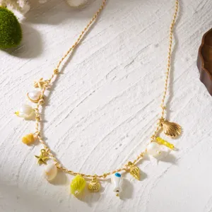 Close-up of bohemian body chain featuring ocean-themed starfish and shell charms.
