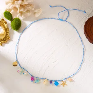 Detailed view of bohemian beach waist chain with shells and starfish charms