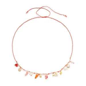 Detailed view of bohemian beach waist chain with assorted ocean-themed charms
